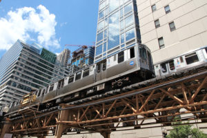 CHICAGO USA - JUNE 28 2013: People ride Chicago's elevated train. L train system served 231 million rides in 2012.