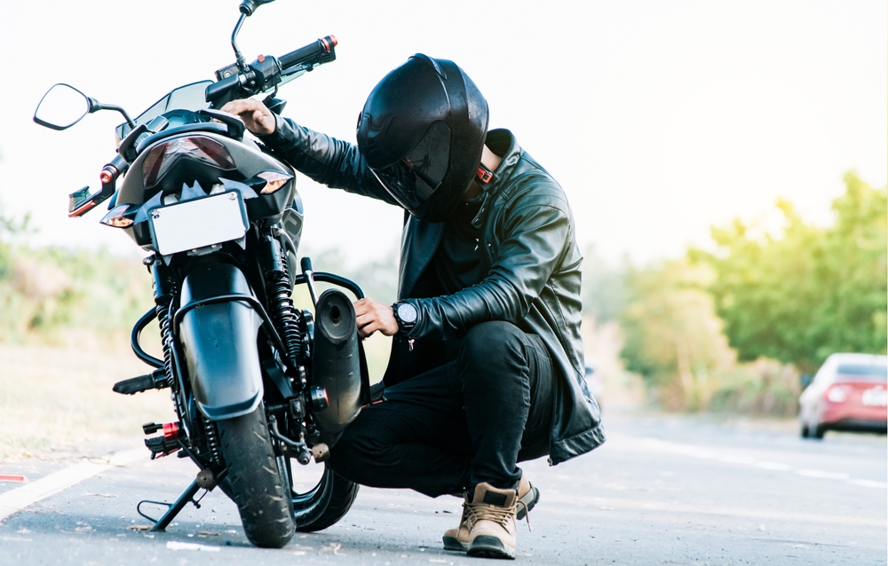 Motorcyclists Nearby his Bike