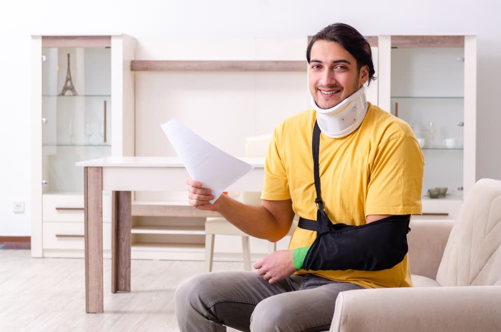 A young man experiences discomfort at home following a car accident.