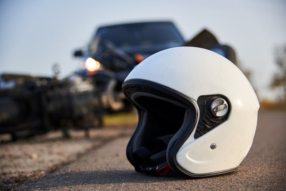 A helmet on the road after a car collides with a motorcycle